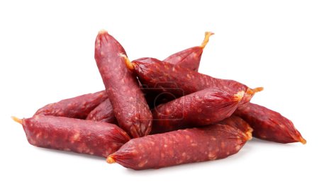 A pile of smoked sausages close-up on a white background. Isolated