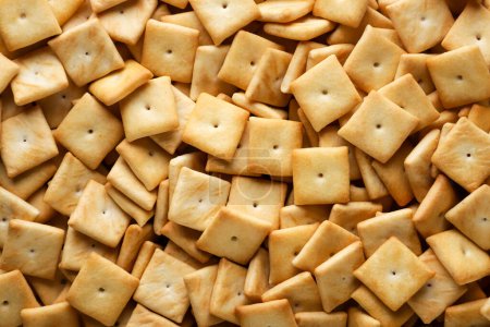 Quadratische Cracker Cookies Nahaufnahme Hintergrund. Ansicht von oben