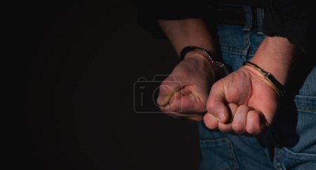 Photo for Arrested man in handcuffs - Royalty Free Image