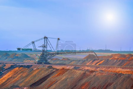 Photo for Industrial view of opencast mining quarry with machinery at work. Area has been mined for copper,silver, gold, and other minerals - Royalty Free Image