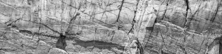Graues Grunge-Banner. Abstrakte Berge rissigen Stein Hintergrund. Die Textur der Steinmauer. Nahaufnahme. Graue Felskulisse
