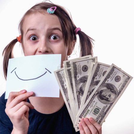 Money isn't happiness. Beautiful young girl with banner with fake smile and US Dollar bills. 