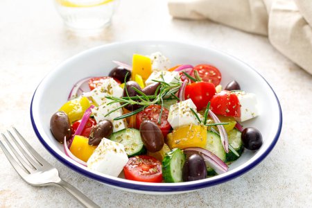 Photo for Greek salad. Vegetable salad with feta cheese, tomato, olives, cucumber, red onion and olive oil. Healthy vegetarian mediterranean diet food - Royalty Free Image