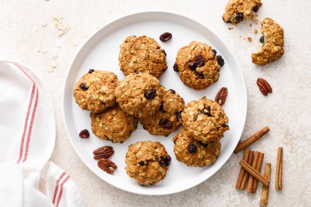 Oatmeal cranberry healthy homemade cookies with cinnamon and pecan nuts for breakfast