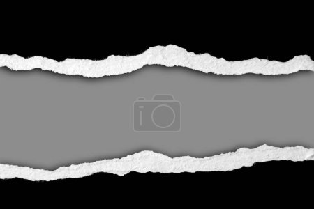 Photo for Ripped black paper on grey background - Royalty Free Image