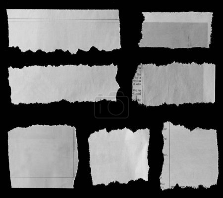 Photo for Seven pieces of torn newspaper on black background - Royalty Free Image