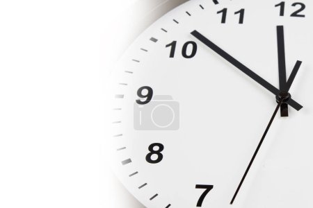 Photo for Closeup of hands on clock face on white - Royalty Free Image