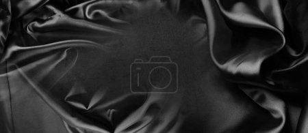 Foto de Primer plano de tela de seda negra ondulada - Imagen libre de derechos