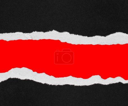 Photo for Ripped black paper on red background - Royalty Free Image