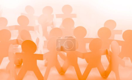 Foto de Equipo de gente de la cadena de papel unidos tomados de la mano - Imagen libre de derechos