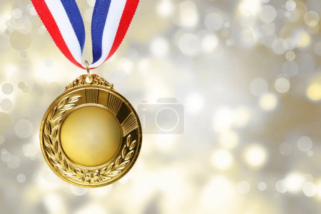 Photo for First place golden medal award in front of blurred background - Royalty Free Image