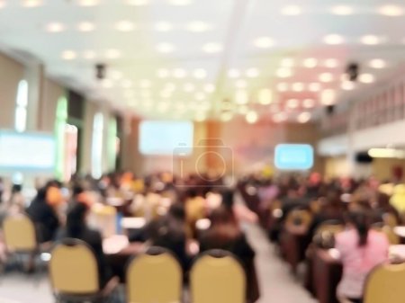 Téléchargez les photos : Business people at a conference hall watching large screen and listening marketing content - en image libre de droit