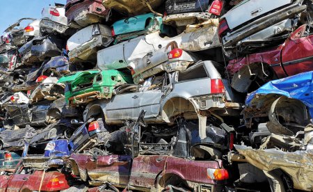 Photo for Stacked crushed cars in scrap yard - Royalty Free Image