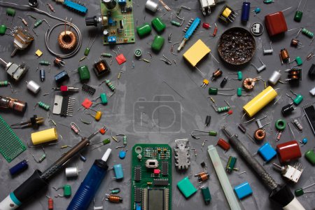 Photo for Different electronic components and equipment. flat lay with space for text on gray concrete background. set of spare parts DIY. - Royalty Free Image