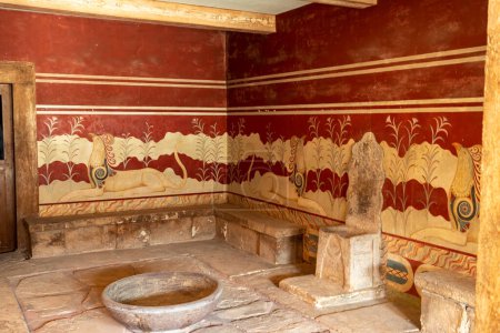 Crete, Greece August 27, 2023: The hall of the throne in the Minoan Palace of Knossos. Ancient ruines of famouse Knossos palace at Crete island, Greece.