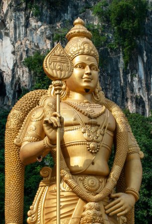 Batu Caves, Gombak, Selangor, Malaysia - 20 August 2011: Batu Caves and the Murugan statue. The cave complex is one of the most popular Hindu shrines and is dedicated to Murugan.