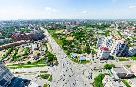 Photo for Aerial city view with crossroads and roads, houses, buildings, parks and parking lots, bridges. Urban landscape. Copter shot. Panoramic image. - Royalty Free Image