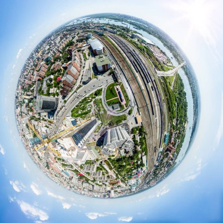 Photo for Aerial city view with crossroads, roads, houses, buildings, parks and parking lots. Copter drone helicopter shot. Panoramic wide angle image. - Royalty Free Image