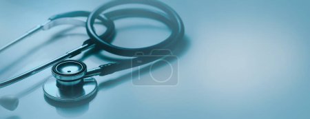 Foto de Healthcare and medical industry. doctor stethoscope on blue background. banner with copy space - Imagen libre de derechos