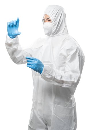 Téléchargez les photos : Worker wears medical protective suit or white coverall suit with mask and goggles hand extend isolated on white background - en image libre de droit