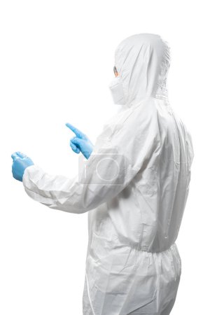 Photo for Worker wears medical protective suit or white coverall suit with mask and goggles finger point isolated on white background - Royalty Free Image