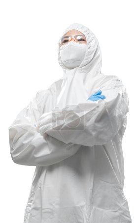 Foto de Worker wears medical protective suit or white coverall suit with mask and goggles fold arms isolated on white background - Imagen libre de derechos