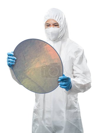 Foto de Worker or engineer wears medical protective suit or white coverall suit with silicon wafer isolated on white - Imagen libre de derechos