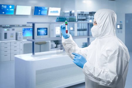 Photo for Worker wears medical protective suit or white coverall suit with test tube in laboratory - Royalty Free Image
