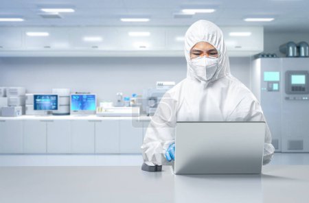 Téléchargez les photos : Worker or engineer wears protective suit or white coverall suit work in semiconductor manufacturing factory - en image libre de droit
