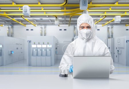 Foto de Worker or engineer wears protective suit or white coverall suit work in semiconductor manufacturing factory - Imagen libre de derechos