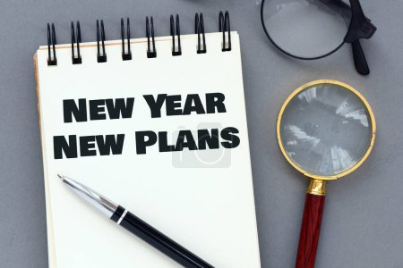 Photo for NEW YEAR NEW PLANS, words in an office notebook. - Royalty Free Image