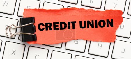 Photo for CREDIT UNION on a small red piece of paper. - Royalty Free Image