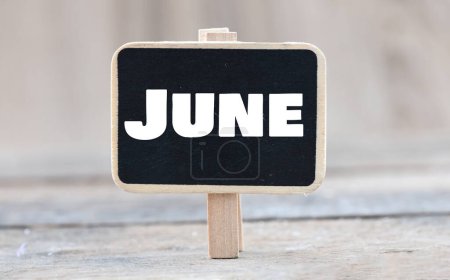 June word on a small chalk board.-stock-photo