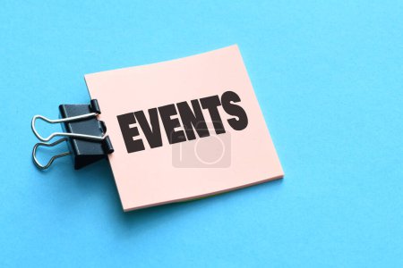 The word EVENTS on a small piece of paper.