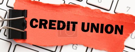Photo for CREDIT UNION on a small red piece of paper. - Royalty Free Image