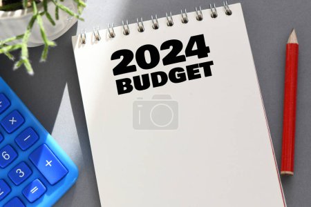 Photo for Budget planning concept for 2024. Text in a notepad on the background of a financial report. Office desk - Royalty Free Image