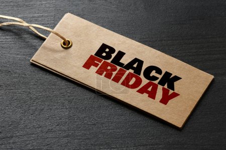 Photo for Black Friday words written on a piece of paper. Time for promotions and sales in stores. - Royalty Free Image