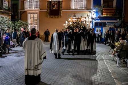 Photo for VILLAJOYOSA, SPAIN - APRIL 7, 2023: Procession during Holy Week in La Vila Joiosa going through the streets of the Old Town. The procession is organized by ten brotherhoods that are in charge of bringing out the passion, death and resurrection of Jes - Royalty Free Image