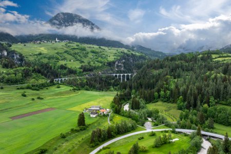 The Landwasser Viaduct is a single-track six-arched curved limestone railway viaduct. It spans the Landwasser between Schmitten and Filisur, in the canton of Graubunden in Switzerland.