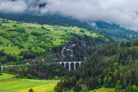 The Landwasser Viaduct is a single-track six-arched curved limestone railway viaduct. It spans the Landwasser between Schmitten and Filisur, in the canton of Graubunden in Switzerland.