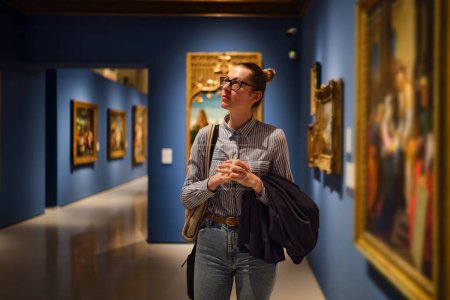 Photo for Women in the museum looks at art exhibitions gallery - Royalty Free Image