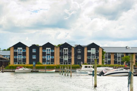 Photo for COPENHAGEN, DENMARK - JULY 2, 2014: Modern apartments and boats seeing from the tour boat deck in Copenhagen - Royalty Free Image
