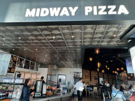 Photo for NEW ORLEANS, LA - NOV 21: Midway Pizza at MSY Louis Armstrong New Orleans International Airport in Louisiana, as seen on Nov 21, 2023. - Royalty Free Image