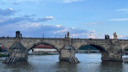 PRAGUE, CZECH REPUBLIC - JUL 8: Charles Bridge on the Vltava River, in Prague, Czech Republic, as seen on July 8, 2022.