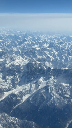 View of the Hindu Kush mountains in the Himalayas in India from an Airplane