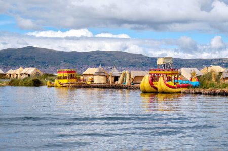 Photo for Uros, Peru - January 09, 2022: Floating islands with indigenous peoples houses made of reeds on Titicaca lake. - Royalty Free Image