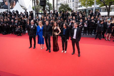 Photo for CANNES, FRANCE - MAY 16, 2023: Members of the Camera dOr Jury Nicolas Marcade, Nathalie Durand, Anais Demoustier, Raphael Personnaz, Sophie Frilley and Mikael Buch attend opening ceremony red carpet - 76 annual Cannes film festival - Royalty Free Image