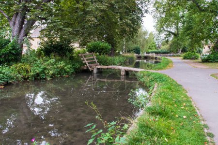 Photo for The village and stream of Lower Slaughter in the Cotswolds - Royalty Free Image