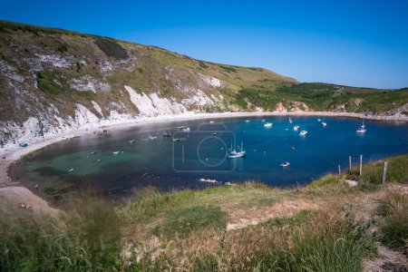 Photo for Lulworth Cove is a cove near the village of West Lulworth, on the Jurassic Coast in Dorset, southern England - Royalty Free Image