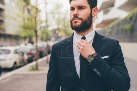 Foto de Young elegant professional executive bearded businessman posing outdoors confident and reassuring - Imagen libre de derechos